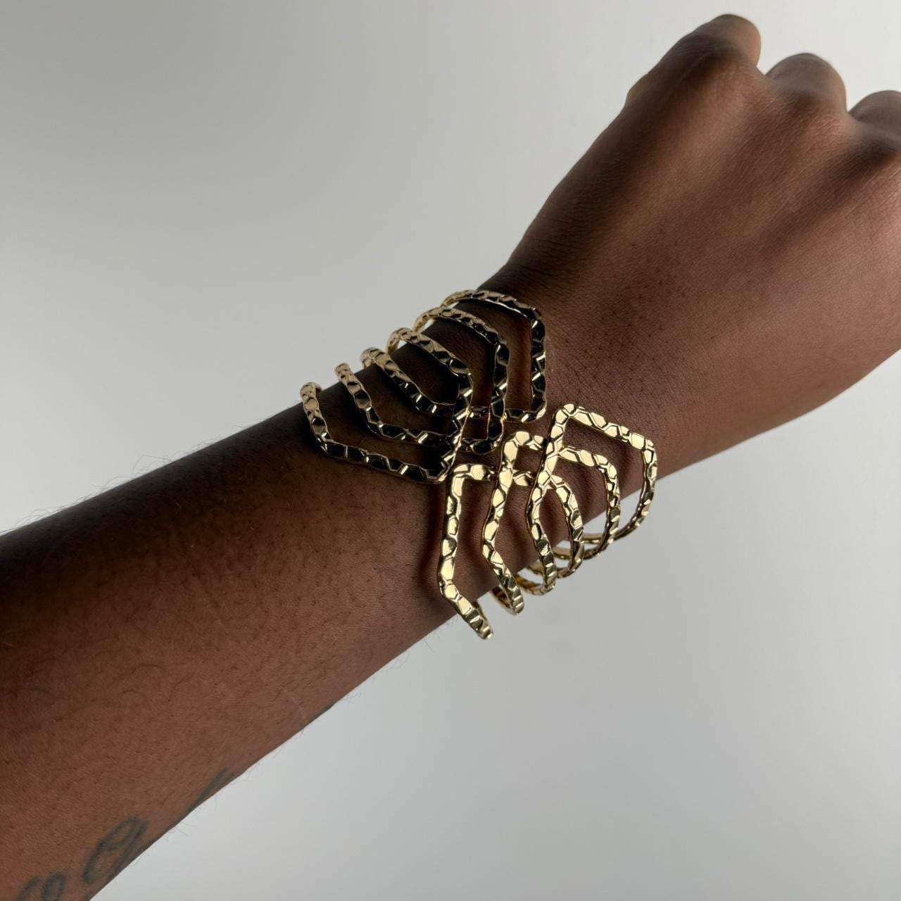 Gold tone bangle cuff