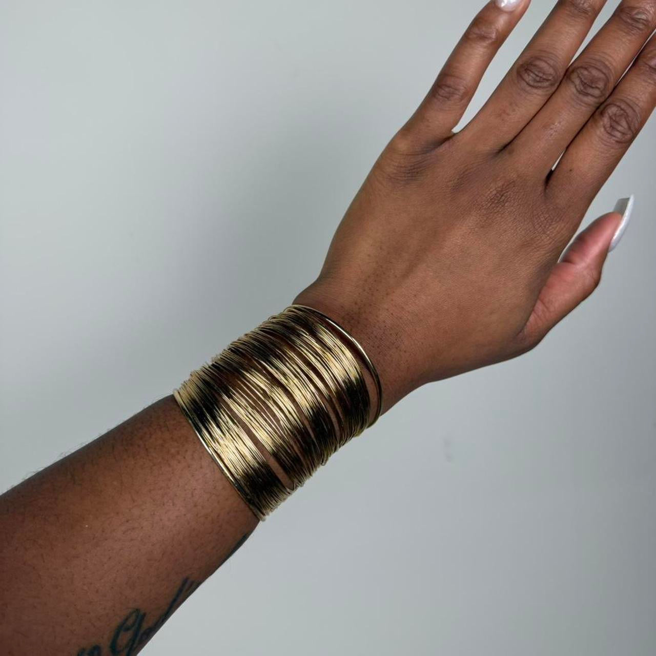 Gold tone bangle cuff