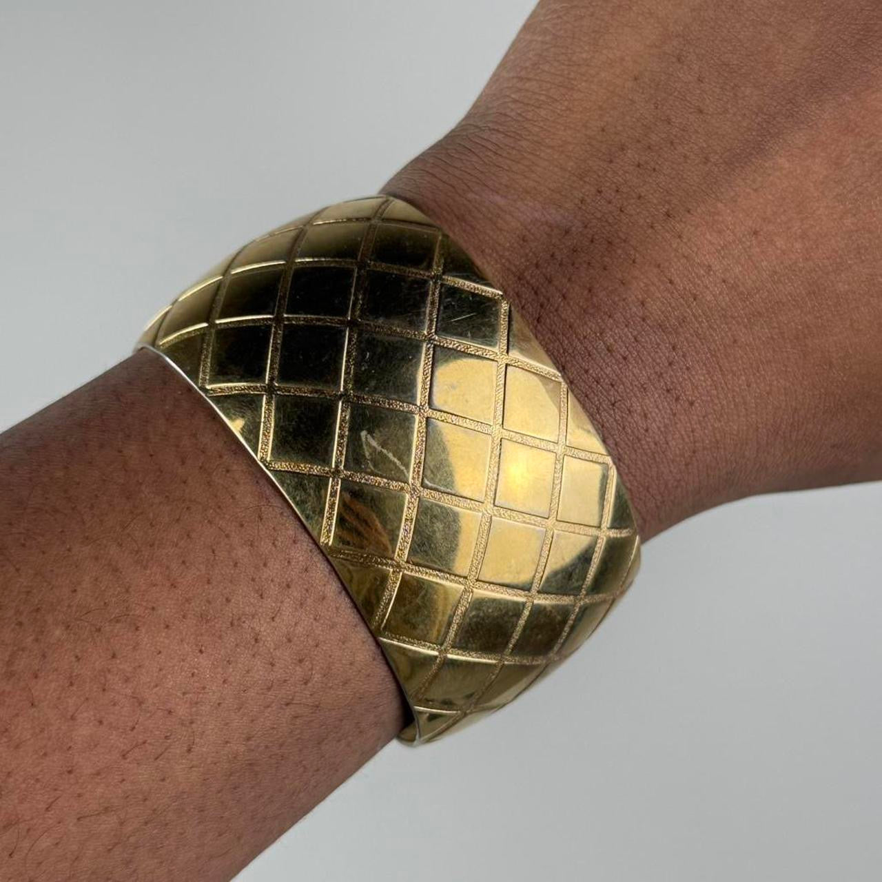 Gold tone bangle cuff