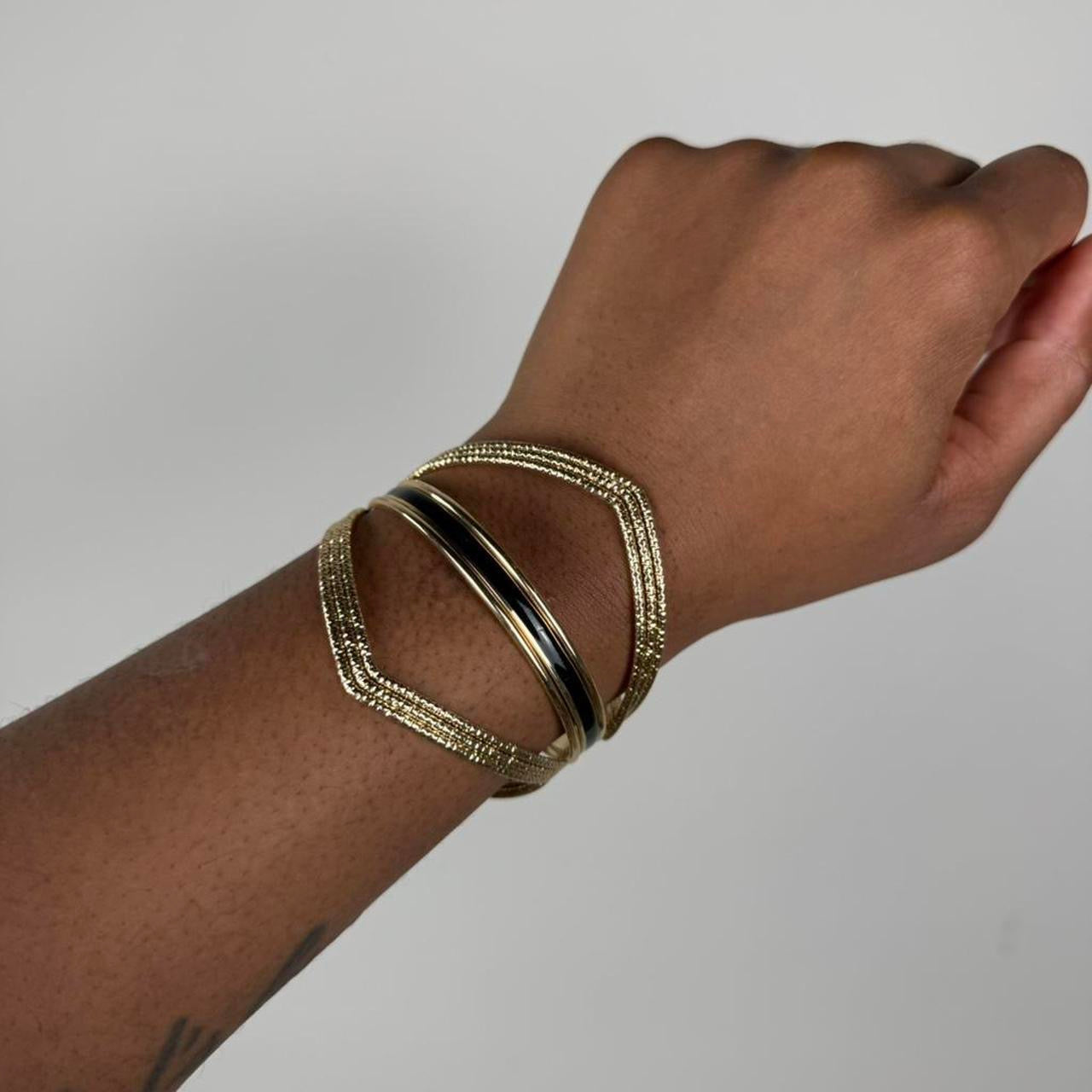 Gold tone bangle cuff