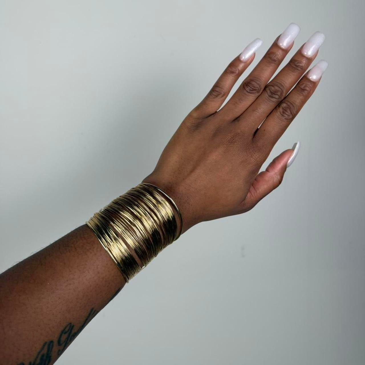 Gold tone bangle cuff