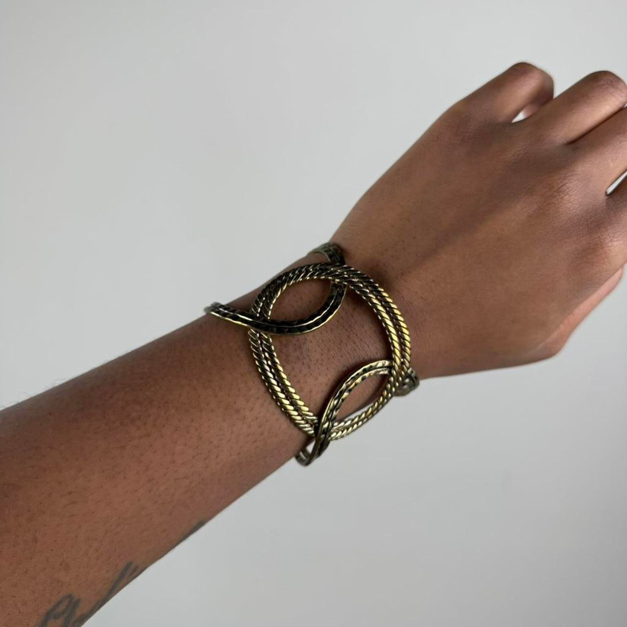 Gold tone bangle cuff