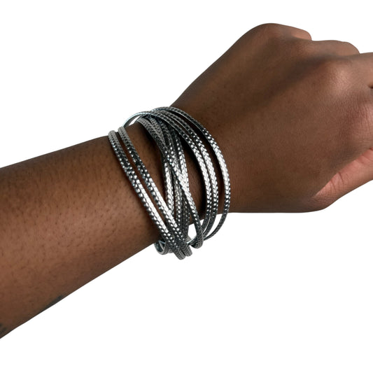 Silver tone bangle infinity stack
