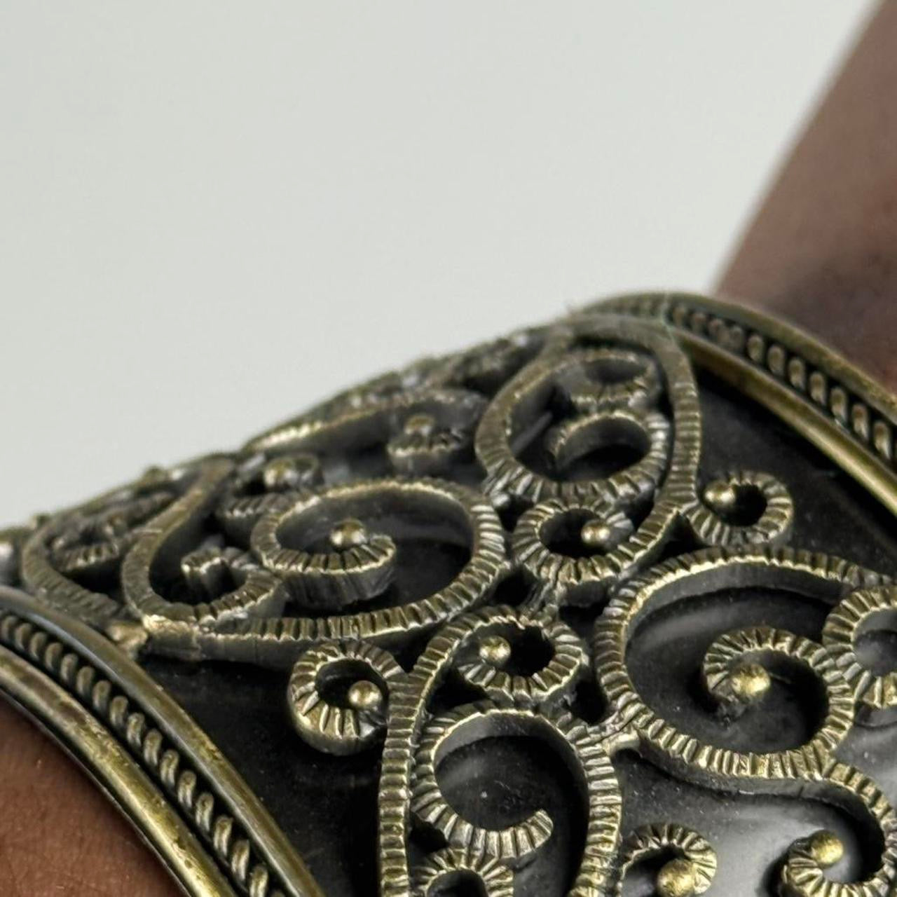Gold tone bangle cuff