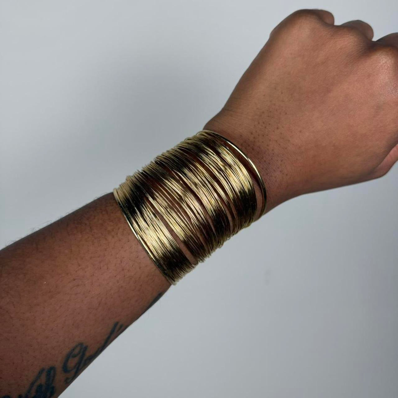 Gold tone bangle cuff
