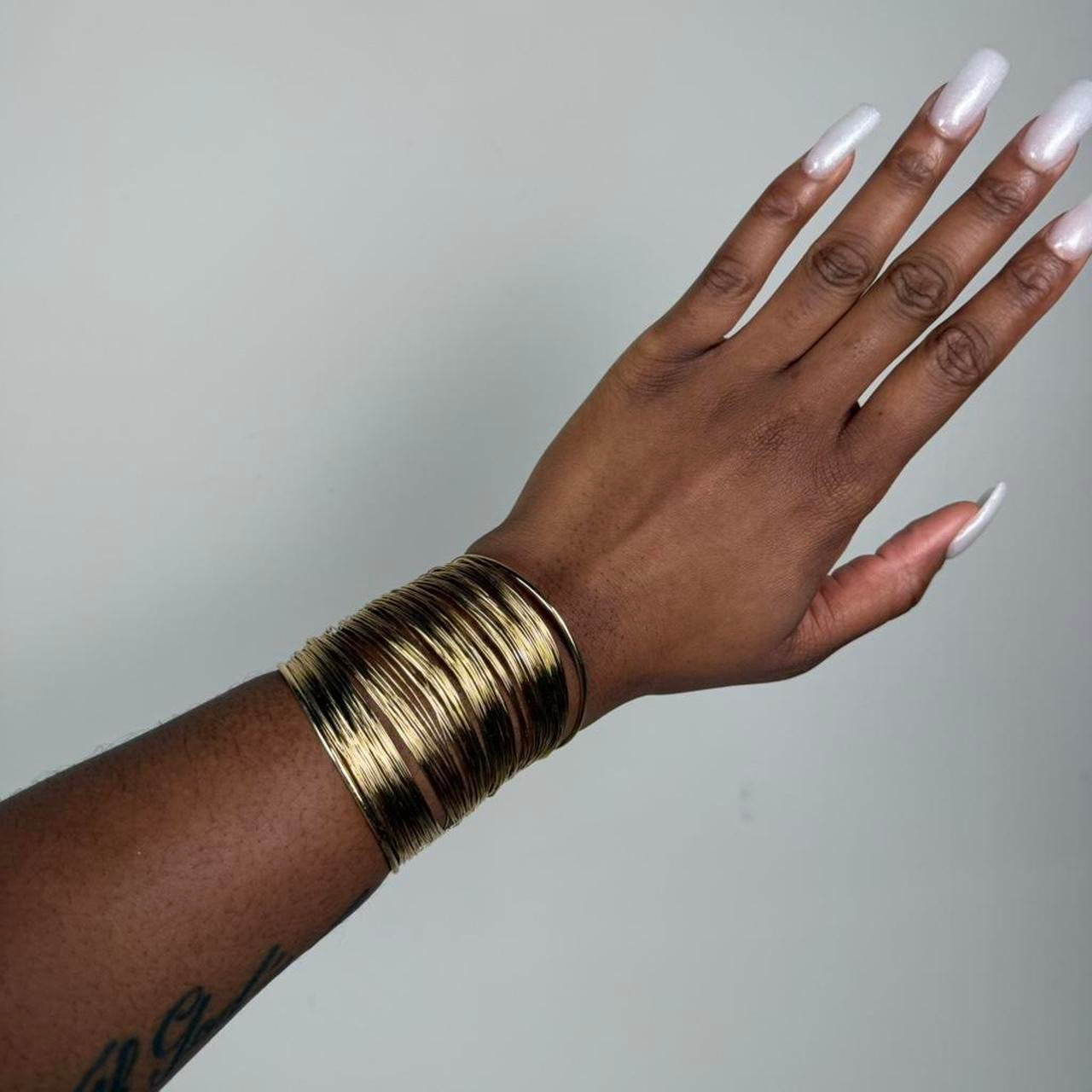 Gold tone bangle cuff