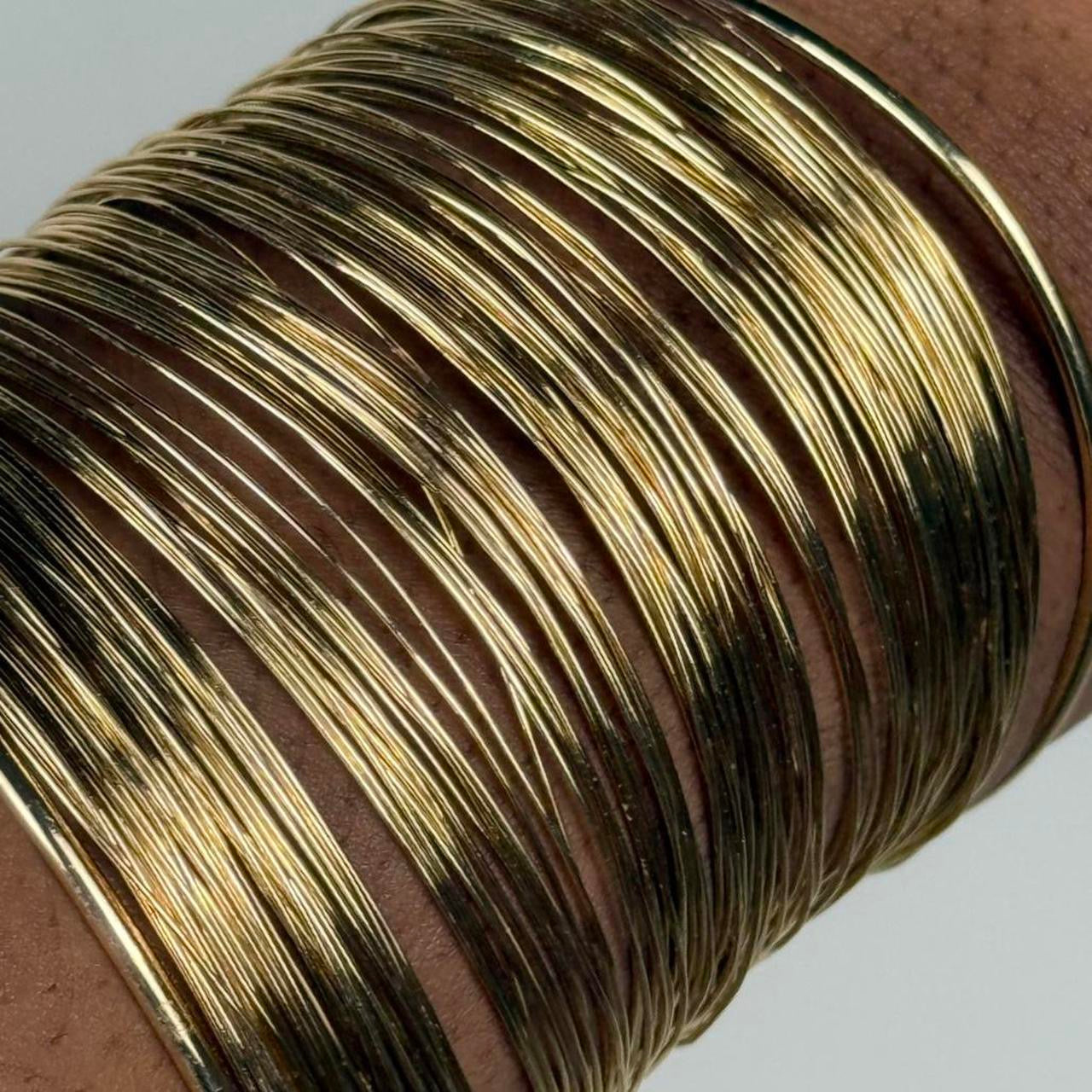 Gold tone bangle cuff